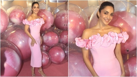 Kiara Advani embraced the Barbiecore trend while attending an event. She wore an off-shoulder dress featuring taffeta flowers on the neckline, a corseted bodice, a back slit, and a figure-hugging silhouette. (Instagram)