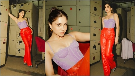 Sharvari Wagh looks dazzling in a lavender lace-embroidered corset blouse and vibrant red leather pants. She styled the ensemble with a half-tied hairdo, embellished pumps, gold hoop earrings, and striking glam. (Instagram)