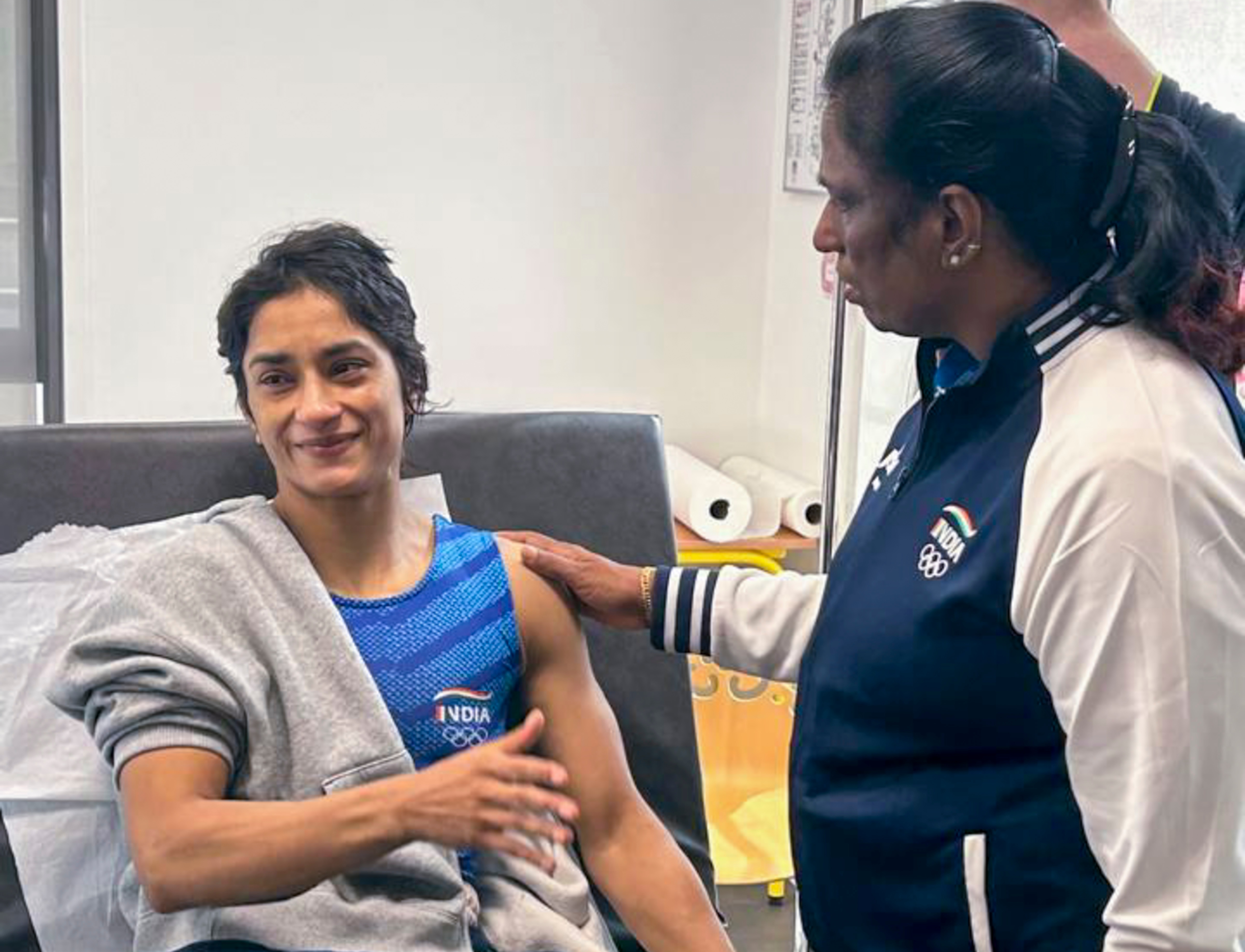 **EDS: IMAGE VIA IOA** Paris: Indian Olympics Association (IOA) President PT Usha meets wrestler Vinesh Phogat after the latter was hospitalised following her disqualification from the Paris Olympics as she was found overweight ahead of her women's 50kg final match, in Paris, France, Wednesday, Aug. 7, 2024. (PTI Photo) (PTI08_07_2024_000419B) (PTI) **EDS: IMAGE VIA IOA** Paris: Indian Olympics Association (IOA) President PT Usha meets wrestler Vinesh Phogat after the latter was hospitalised following her disqualification from the Paris Olympics as she was found overweight ahead of her women's 50kg final match, in Paris, France, Wednesday, Aug. 7, 2024. (PTI Photo) (PTI08_07_2024_000419B) (PTI)