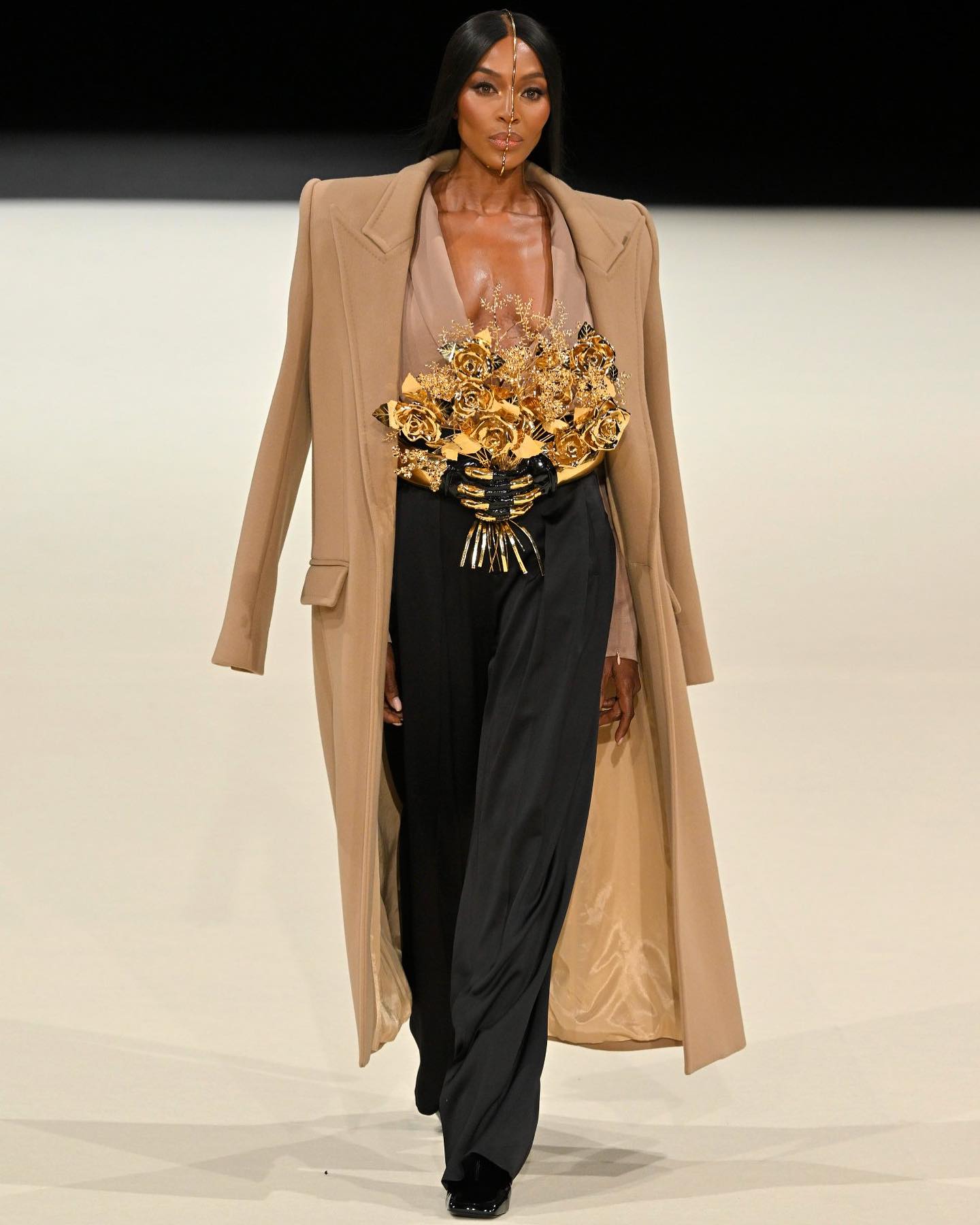 Naomi Campbell walks the runway in a Balmain gold bouquet belt(Photo: Instagram)