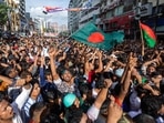 People gather in front of the Bangladesh Nationalist Party (BNP) headquarters during a rally in Dhaka, Bangladesh. (AP)