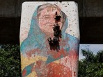 A view shows a mural of Bangladeshi Prime Minister Sheikh Hasina vandalised by protesters, a day after her resignation, in Dhaka. 