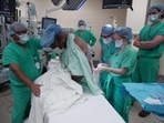 Harry Stackhouse, 74, receives a spinal anesthetic before surgery at Northwestern Medicine in Chicago, Illinois. "I saw everything": Stackhouse, from Illinois who was awake during a recent kidney transplant, says he felt no pain as he chatted with doctors, eyed up the donor organ before it was implanted, and watched the surgical team staple him back up. Stackhouse was discharged just 36 hours after the procedure at Northwestern Medicine, which is hoping to make transplantations that don't require risky general anesthesia commonplace. 