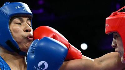 China's Li Qian (R) and India's Lovlina Borgohain (Blue) compete in the women's 75kg quarter-final boxing match. (AFP) China's Li Qian (R) and India's Lovlina Borgohain (Blue) compete in the women's 75kg quarter-final boxing match. (AFP)