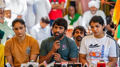 Wrestlers Bajrang Punia, Vinesh Phogat and Sakshi Malik (PTI) Wrestlers Bajrang Punia, Vinesh Phogat and Sakshi Malik (PTI)