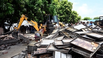 Ayodhya: A bulldozer being used to demolish the bakery of Moid Khan who is accused of allegedly raping a 12-year-old girl, in Ayodhya, Saturday, Aug. 3, 2024. (PTI)