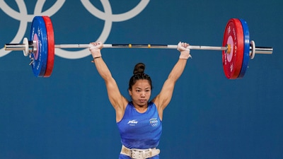 India's Mirabai Chanu competes during the clean and jerk stage of the women's 49kg weightlifting event at the 2024 Summer Olympics, in Paris. (PTI) India's Mirabai Chanu competes during the clean and jerk stage of the women's 49kg weightlifting event at the 2024 Summer Olympics, in Paris. (PTI)