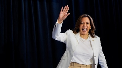 U.S. Vice President and Democratic presidential candidate Kamala Harris waves at the stage during a campaign rally with her newly-chosen vice presidential running mate, Minnesota Governor Tim Walz, at Detroit Metropolitan Wayne County Airport in Romulus, Michigan, U.S., (REUTERS)