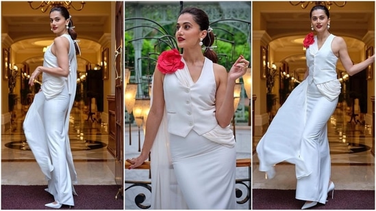 Taapsee Pannu is back with yet another chic saree look. This time, she chose an all-white ensemble featuring a subtle drape paired with a waistcoat and a striking red rose embellishment. With a stylish hairdo and statement stud earrings, she once again proves her fashion savvy.(Instagram)