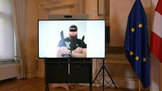 A screen shows a picture of a man arrested in connection with the Islamist attack plot that led to the cancellation of the Vienna leg of US mega-star Taylor Swift's tour. The incident took place during a press conference at the Foreign Ministry in Vienna, Austria, on August 8, 2024. The intelligence agency said the 19-year-old IS supporter was planning a suicide attack at Taylor Swift's concert in Vienna, aiming to kill several people. (AFP) A screen shows a picture of a man arrested in connection with a plot to stage an Islamist attack that forced the cancellation of the Vienna leg of US mega-star Taylor Swift's tour. The incident took place during a press conference at the Foreign Ministry in Vienna, Austria, on August 8, 2024. The intelligence agency said the 19-year-old IS supporter was planning a suicide attack at Taylor Swift's concert in Vienna, aiming to kill several people. (AFP)