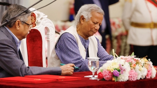 Nobel laureate Muhammad Yunus signs the oath book as the country’s head of the interim government in Bangladesh at the Bangabhaban, in Dhaka, Bangladesh, August 8, 2024. REUTERS/Mohammad Ponir Hossain