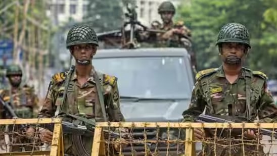 Soldiers stand guard in Bangladesh amid violence. 