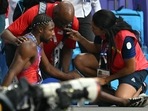 Bronze medallist, US' Noah Lyles receives medical attention after competing in the men's 200m final of the athletics event at the Paris 2024 Olympic Games at Stade de France in Saint-Denis