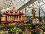 A 12-foot-tall statue of Dr Ambedkar alongside a floral model of the Parliament at the Lalbagh Flower Show(Photo: Aayushi Parekh/HT) A 12-foot-tall statue of Dr Ambedkar alongside a floral model of the Parliament at the Lalbagh Flower Show(Photo: Aayushi Parekh/HT)