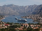 Cruise ships ferrying thousands of daily visitors navigate to dock at the city port amid concerns about 'over-tourism' in Kotor, Montenegro. (REUTERS)