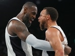 Lebron James of the United States and Stephen Curry celebrate after the match against Serbia