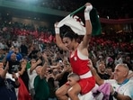 Algeria's Imane Khelif celebrates after defeating China's Yang Liu to win gold in their women's 66 kg final boxing match at the 2024 Summer Olympics(AP) Algeria's Imane Khelif celebrates after defeating China's Yang Liu to win gold in their women's 66 kg final boxing match at the 2024 Summer Olympics(AP)