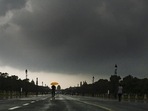 People caught in the rain at Kartavya Path, in New Delhi on Friday. (RAJ K RAJ /HT PHOTO) People caught in the rain at Kartavya Path, in New Delhi on Friday. (RAJ K RAJ /HT PHOTO)