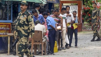 BSF personnel keep vigil as truck drivers complete formalities to return to India from Bangladesh at the India-Bangladesh border checkpost in Dakshin Dinajpur district of West Bengal. (PTI Photo) BSF personnel keep vigil as truck drivers complete formalities to return to India from Bangladesh at the India-Bangladesh border checkpost in Dakshin Dinajpur district of West Bengal. (PTI Photo)