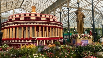 A 12-foot-tall statue of Dr Ambedkar alongside a floral model of the Parliament at the Lalbagh Flower Show (Photo: Aayushi Parekh/HT) A 12-foot-tall statue of Dr Ambedkar alongside a floral model of the Parliament at the Lalbagh Flower Show (Photo: Aayushi Parekh/HT)