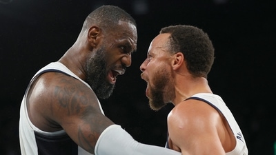 Lebron James of the United States and Stephen Curry celebrate after the match against Serbia (REUTERS)