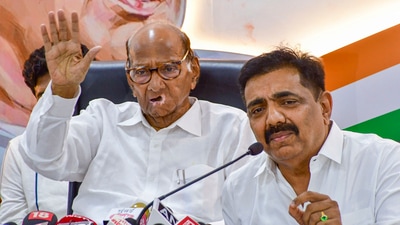 Jayant Patil (right) with NCP SP chief Sharad Pawar (File Photo/PTI) Jayant Patil (right) with NCP SP chief Sharad Pawar (File Photo/PTI)