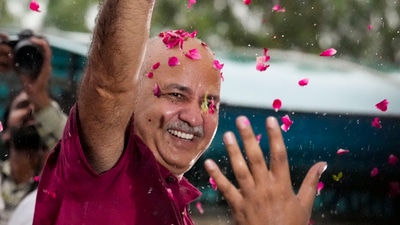 New Delhi: AAP leader Manish Sisodia waves to supporters after being released from Tihar jail following his bail granted by the Supreme Court in the corruption and money laundering cases linked to the alleged Delhi excise policy scam. (PTI) New Delhi: AAP leader Manish Sisodia waves to supporters after being released from Tihar jail following his bail granted by the Supreme Court in the corruption and money laundering cases linked to the alleged Delhi excise policy scam. (PTI)