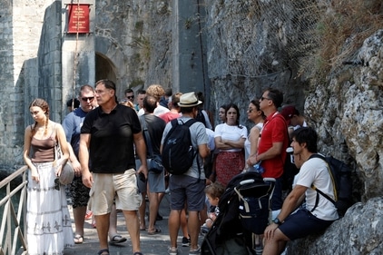 Tourists crowd in front of the Gurdic Gate of the Old Town, amidst concerns about 'over-tourism' in Kotor. (REUTERS)