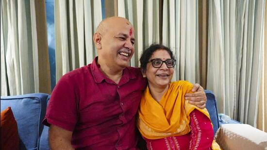 AAP leader Manish Sisodia with wife upon his arrival at his residence after being released from the Tihar Jail following his bail granted by the Supreme Court on Friday. (PTI)