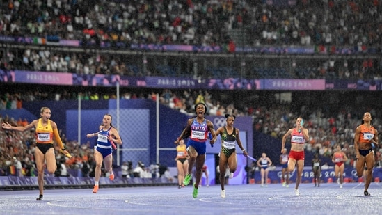 There were incredible scenes at a rain-soaked Stade de France as the USA won the women's 4x100m relay despite being fourth at the start of the anchor run. It was talisman Sha'Carri Richardson who shot up to the front and even led the final quarter of her 100m stretch. (AFP)