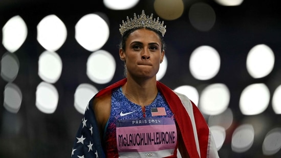 Gold medallist US' Sydney Mclaughlin-Levrone wears a crown as she celebrates winning the women's 400m hurdles final of the athletics event (AFP)