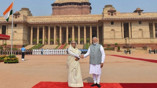 Prime Minister Narendra Modi shaking hands with former Bangladesh Prime Minister Sheikh Hasina after receiving her at the Rashtrapati Bhavan in New Delhi on June 22, 2024. (Photo by PIB / AFP) 