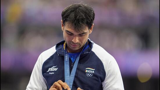 Neeraj Chopra at the podium during the victory ceremony for the men's javelin throw at the Paris Olympics. (PTI)