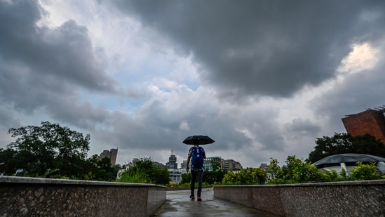 Dark clouds and light rainfall at Connaught Place. (RAJ K RAJ /HT PHOTO)