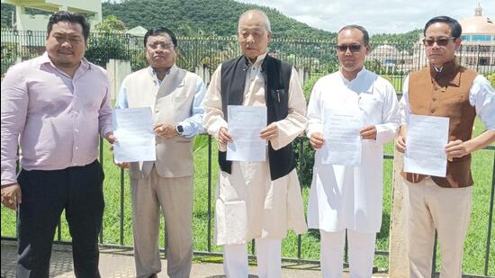 Opposition MLAs of Manipur demonstrate outside the assembly on Friday. (HT Photo)