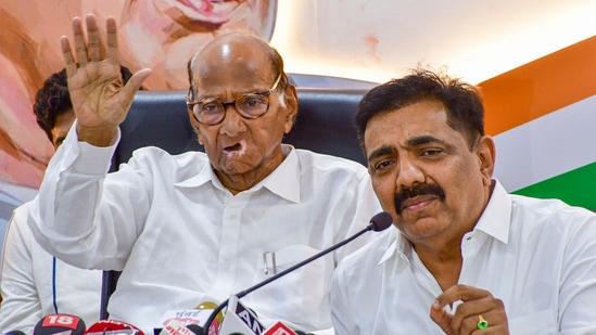 Jayant Patil (right) with NCP SP chief Sharad Pawar (File Photo/PTI)