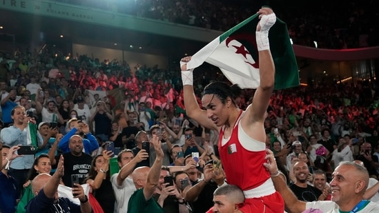 Algeria's Imane Khelif celebrates after defeating China's Yang Liu to win gold in their women's 66 kg final boxing match at the 2024 Summer Olympics(AP)