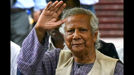 TOPSHOT - Nobel laureate and chief adviser of Bangladesh's new interim government, Muhammad Yunus greets the public after laying a wreath at the National Martyrs' Memorial in Dhaka on August 9, 2024. (Photo by Indranil MUKHERJEE / AFP) (AFP)