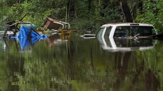 STATESBORO, GEORGIA - AUGUST 7: Trucks are submerged after excessive rains caused flooding on August 7, 2024 in Statesboro, Georgia.. (Photo by Megan Varner / GETTY IMAGES NORTH AMERICA / Getty Images via AFP)(Getty Images via AFP)