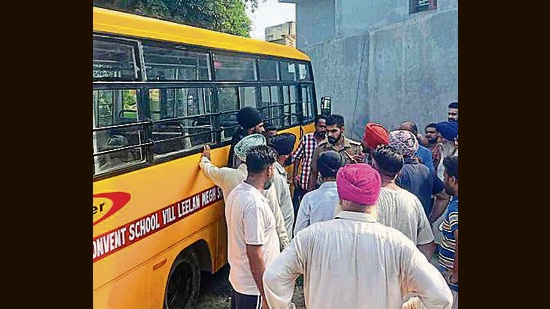 Villagers gathered at spot where a school van crashed into a wall in Village Bujurg in Jagraon in District Ludhiana On Friday (HT Photo)