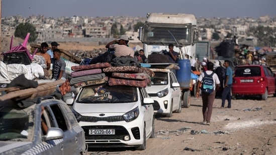 Thousands of people fled eastern Khan Younis in vehicles and on foot, belongings heaped on donkey carts and motorcycle rickshaws as they made their slow escape along congested roads. (AP)