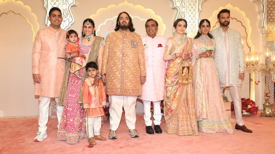 Mukesh Ambani, Akash Ambani, Shloka Ambani, Anand Piramal and Isha Ambani decked up in pastel outfits.