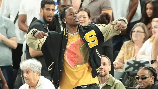 Travis Scott watches the Serbia vs' United States game during a men's semifinals basketball game at Bercy Arena at the 2024 Summer Olympics, Thursday, Aug. 8, 2024, in Paris, France. (AP Photo/Mark J. Terrill)