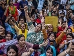 Members of the Bangladeshi Hindu community hold banners and chant slogans against violence targeting the country's minorities during a protest in Dhaka on August 9, 2024, days after a student-led uprising ended the 15-year rule of Sheikh Hasina.(AFP) Members of the Bangladeshi Hindu community hold banners and chant slogans against violence targeting the country's minorities during a protest in Dhaka on August 9, 2024, days after a student-led uprising ended the 15-year rule of Sheikh Hasina.(AFP)
