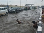 Children play on a waterlogged stretch at Ghazipur on Saturday. (HT Photo) Children play on a waterlogged stretch at Ghazipur on Saturday. (HT Photo)