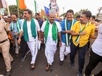 H.D. Kumaraswamy and Karnataka BJP President B.Y. Vijayendra with BJP and JD(S) workers during a week-long 'padyatra' from Bengaluru to Mysuru. H.D. Kumaraswamy and Karnataka BJP President B.Y. Vijayendra with BJP and JD(S) workers during a week-long 'padyatra' from Bengaluru to Mysuru.