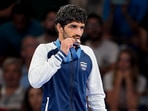 Bronze medalist India's Aman Sehrawat poses for photos at the podium. Bronze medalist India's Aman Sehrawat poses for photos at the podium.