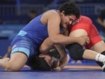 Reetika Hooda (in blue) in action against Kyrgyzstan's Aiperi Medet Kyzy during the Paris Olympics on Saturday. (PTI) Reetika Hooda (in blue) in action against Kyrgyzstan's Aiperi Medet Kyzy during the Paris Olympics on Saturday. (PTI)