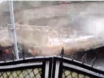 CCTV footage shared by PTI captured the building's collapse on camera amidst continuous rain.