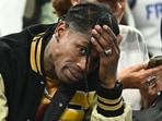 US rap artist Travis Scott gestures as he attends the men's semi-final basketball match between France and Germany during the Paris 2024 Olympic Games at The Bercy Arena in Paris on August 8, 2024. Paris prosecutor's office announced on August 9, 2024, that US rap artist Travis Scott has been arrested in Paris after a fight at The Georges V Hotel in the French capital. US rap artist Travis Scott gestures as he attends the men's semi-final basketball match between France and Germany during the Paris 2024 Olympic Games at The Bercy Arena in Paris on August 8, 2024. Paris prosecutor's office announced on August 9, 2024, that US rap artist Travis Scott has been arrested in Paris after a fight at The Georges V Hotel in the French capital.